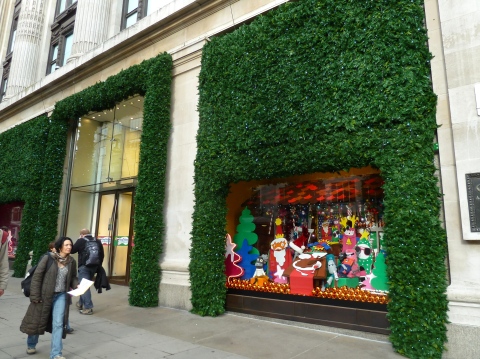 Greenery covers the front of Selfridges windows and doors for Xmas 2010