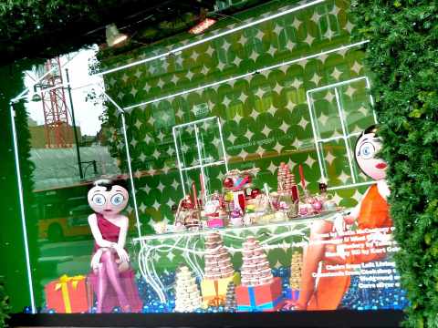 Betty Boop blow ups enjoy muffins and macaroons in Selfridges Christmas 2010 window