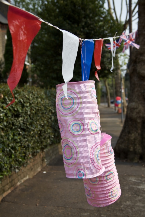 Chinese lanterns joined flags as tree decorations
