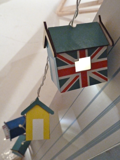 Keeping it nautical, fairy light beach huts by Laura Ashley for summer 2012